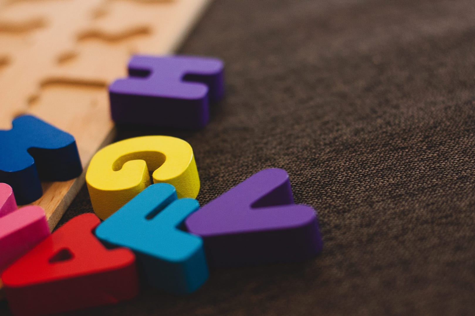 Letter blocks on dark carpet