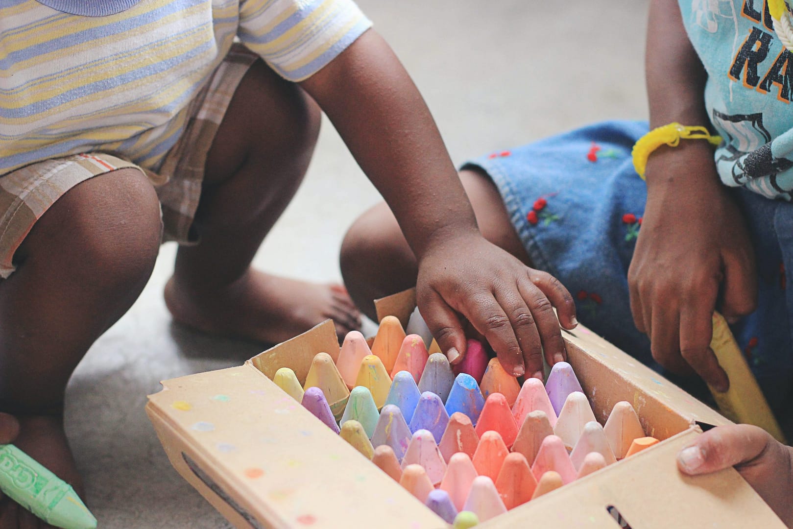 Children picked chalk from a box